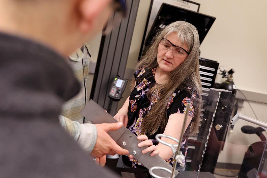 Engineering professor Natasha Smith in the middle of one on one instruction in the classroom